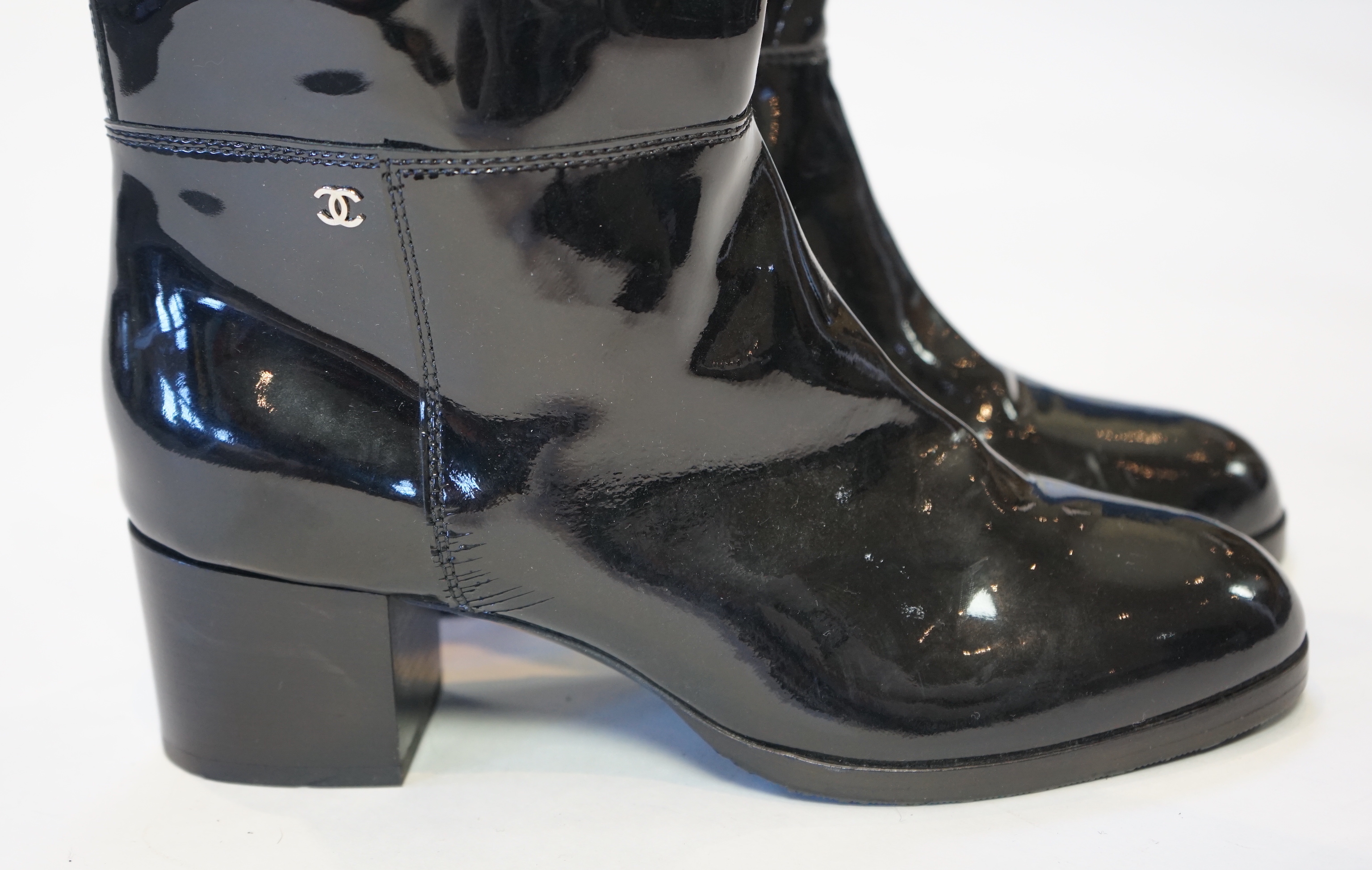 A pair of Chanel lady's black patent knee high mid heel rain boots, size EU 40.5